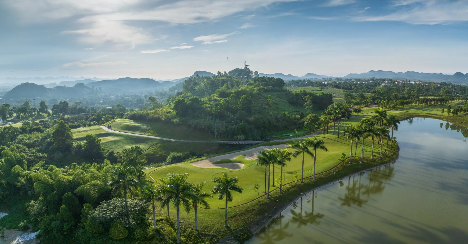 Ninh Binh golf course - Panoramic view of karst limestone mountains and lake